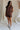 full body view of female model wearing the Thea Brown Ribbed Shorts which features Brown Ribbed Fabric, Two Side Pockets, Elastic Waistband with Drawstring Tie and Gold Hardware Details
