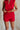 front view of female model wearing the Adriana Gauze Fray Shorts which features Lightweight Gauze Fabric, Fringe Hem, Elastic Waistband, Side Pockets and Fully Lined. the shorts are available in navy blue and red.