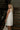 Tabitha Cream Denim Ruffle Mini Dress - back/side view