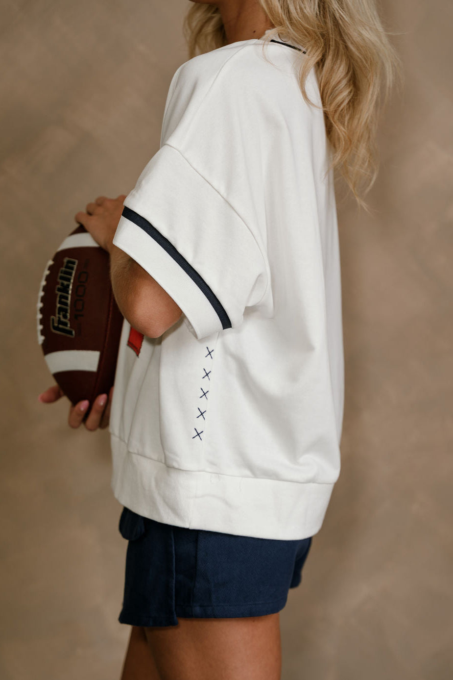 Rowan White, Orange, & Navy "A" Top - close up side view