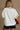Rowan White, Orange, & Navy "A" Top - close up back view