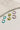 close up view of the Remi Multi Mini Hoops Earring Set which features small teal, lime green and medium size lavender open hoops