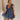 Full body view of model wearing Savannah Navy Floral Mini Dress. This is a navy floral mini dress with ruffle upper details.