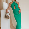 Full body view of model wearing Madelyn Green Halter Maxi Dress. This is a green maxi dress with a halter criss cross neckline.