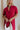 Close up of model wearing Hailey Crimson Red Mini Dress. This is a washed crimson red dress with fray hem, collared neckline, short sleeves.