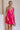 Close up of model wearing Carly Hot Pink Mini Dress. This is a hot pink mini dress, corset looking top and sleeveless.