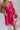 Close up of model wearing Carly Hot Pink Mini Dress. This is a hot pink mini dress, corset looking top and sleeveless.