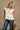 Colette Cream Peplum Flare Sleeveless Top- close up top view