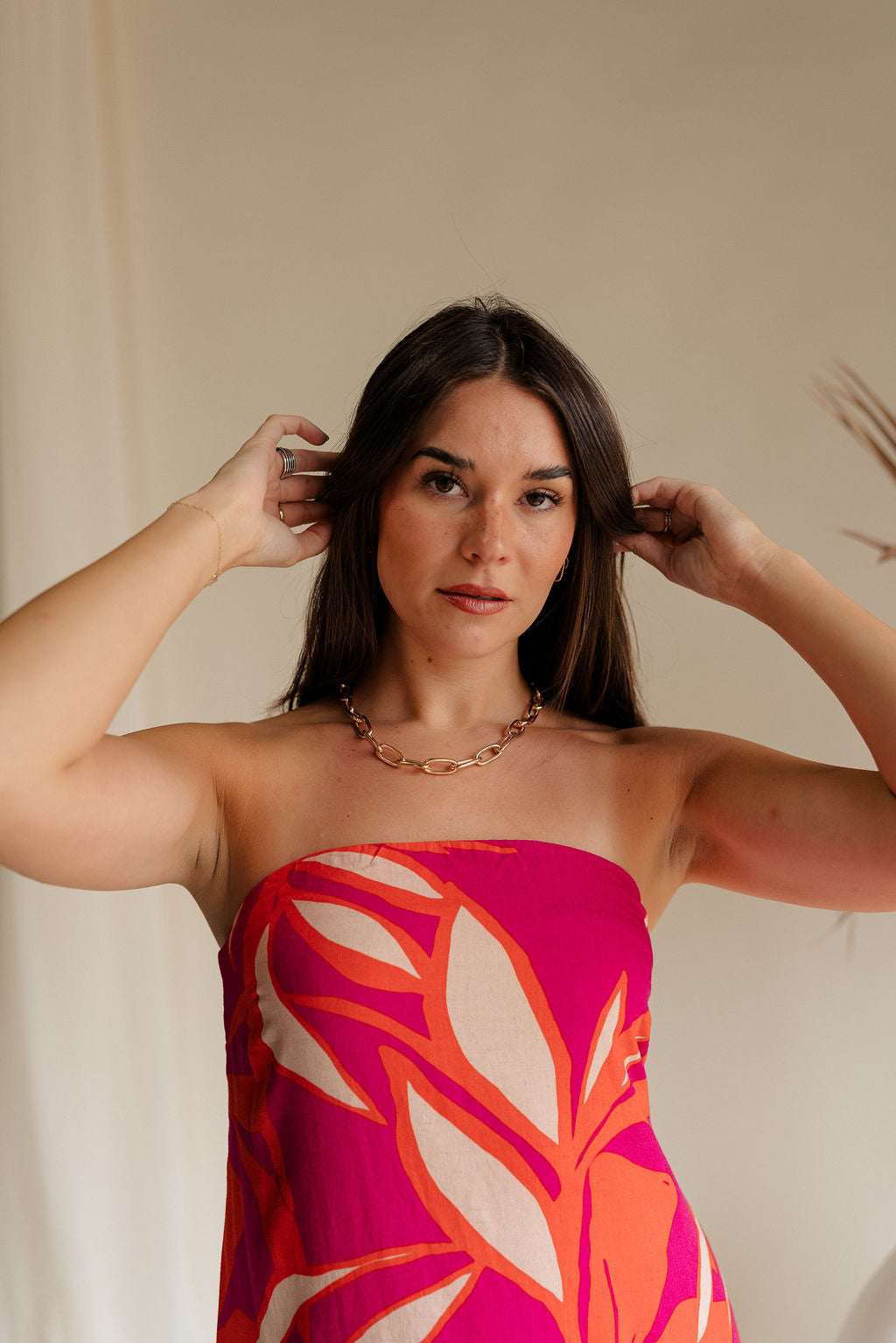 front view of female model wearing the Kiara Gold Chain Link Necklace which features shiny gold chain link necklace