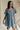 full body view of female model wearing the Charlie Light Denim V-Wire Mini Dress which features Denim Wash Fabric, Mini Length, Square Neckline with V Wire, Smocked Back and Short Puff Sleeves