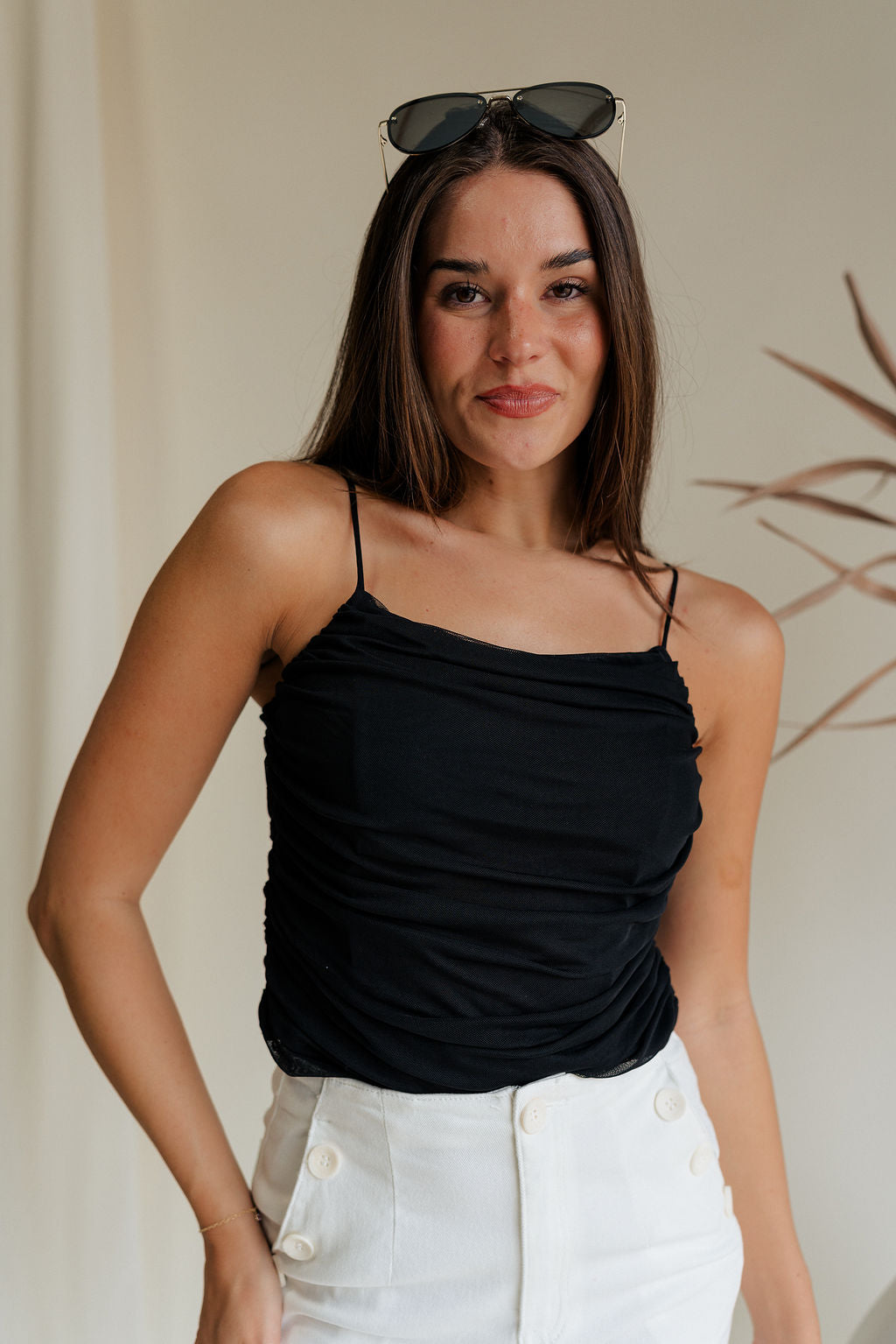 front view of female model wearing the Evie Black Ruched Tank which features Black Mesh Fabric, Black Lining, Ruched Details, Square Neckline and Adjustable Straps