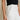 close side view of female model wearing the Poppy White Buttoned Wide Leg Pants which features White Lightweight Fabric, Cropped Wide Leg, Front Zipper with Button Closure, Two Front Pockets with Monochrome Buttons and Two Back Pockets