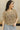 Close up of model wearing the Millie Crochet Short Sleeve Sweater in khaki. This is a cropped sweater top, crochet, short sleeve, comes in either black, white, or khaki.