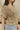 Close up view of model wearing the Millie Crochet Short Sleeve Sweater in khaki. This is a cropped sweater top, crochet, short sleeve, comes in either black, white, or khaki.