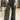 Close up view of model wearing the Emerson Pants in black. These are comfy pants with a ruched waistband, cargo pant look, comes in either black or green.