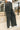 Close up side view of model wearing the Emerson Pants in black. These are comfy pants with a ruched waistband, cargo pant look, comes in either black or green.