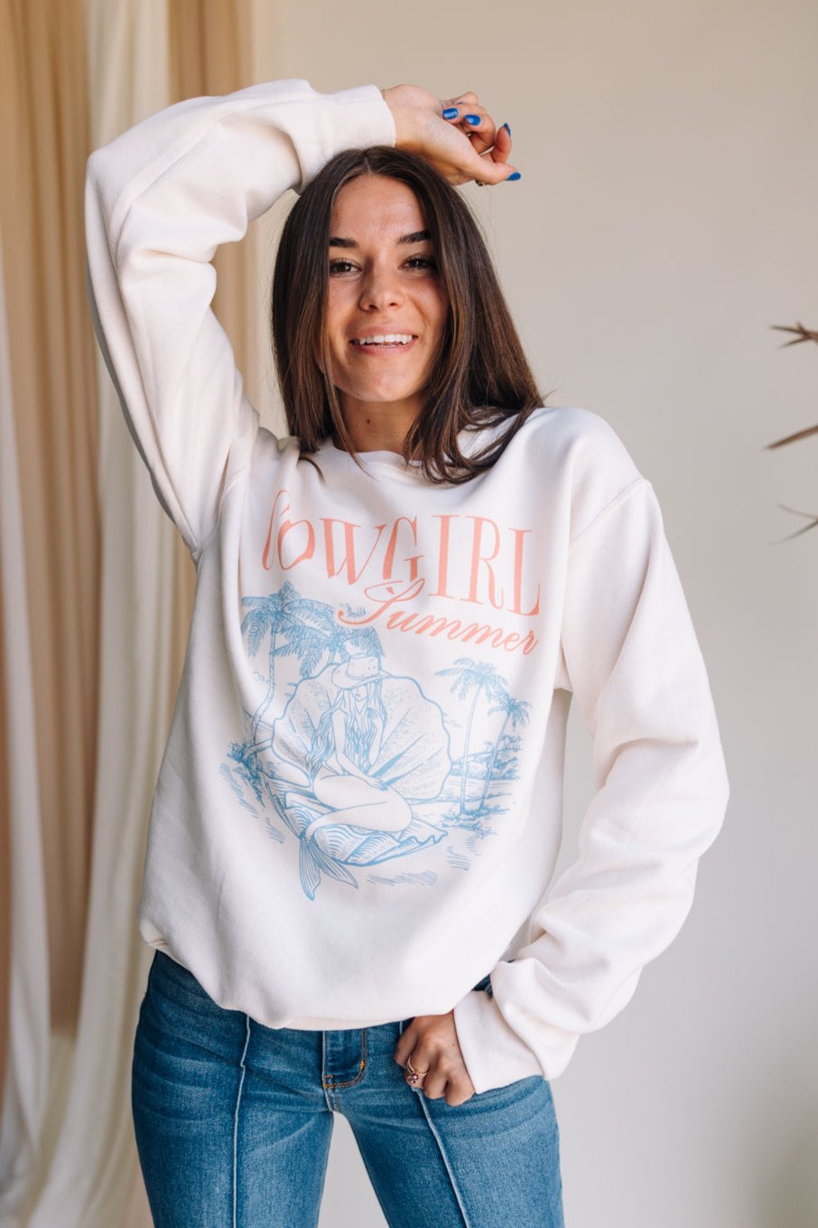 Model is pictured in the Cowgirl Summer Graphic Sweatshirt.