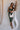Model is pictured wearing the Nyla Olive Bodycon Midi Dress in a size small.
