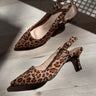 Images shoes side and top view of the Betty Leopard Kitten Heels that have brown leopard material, kitten heels, and sling backs, and pointed toes