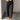 Lower body front view of female model wearing the Rosalind Black Barrel Jeans with a brown tank top and black heels.