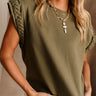 Close front view of female model wearing the Jayla Braided Top in Olive.