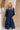 Front view of female model wearing the Penny Button Up 3/4 Sleeve Midi Dress in Navy that has a button up front, 3/4 sleeves, and a collar.