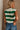 Back view of female model wearing tStacia Green & White Striped Sweater Tank, worn with jeans.