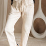 Lower body front view of female model wearing the Bethany Drawstring Cargo Pants in Cream.