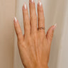 Image shows the Melina Gold & Rhinestone Ring on a female model hand.