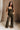 Full body front view of female model wearing the Britney Olive Wide Leg Jumpsuit.