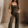 Full body front view of female model wearing the Britney Olive Wide Leg Jumpsuit.