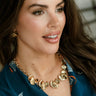Sona Gold Petal Statement Necklace - front view on model