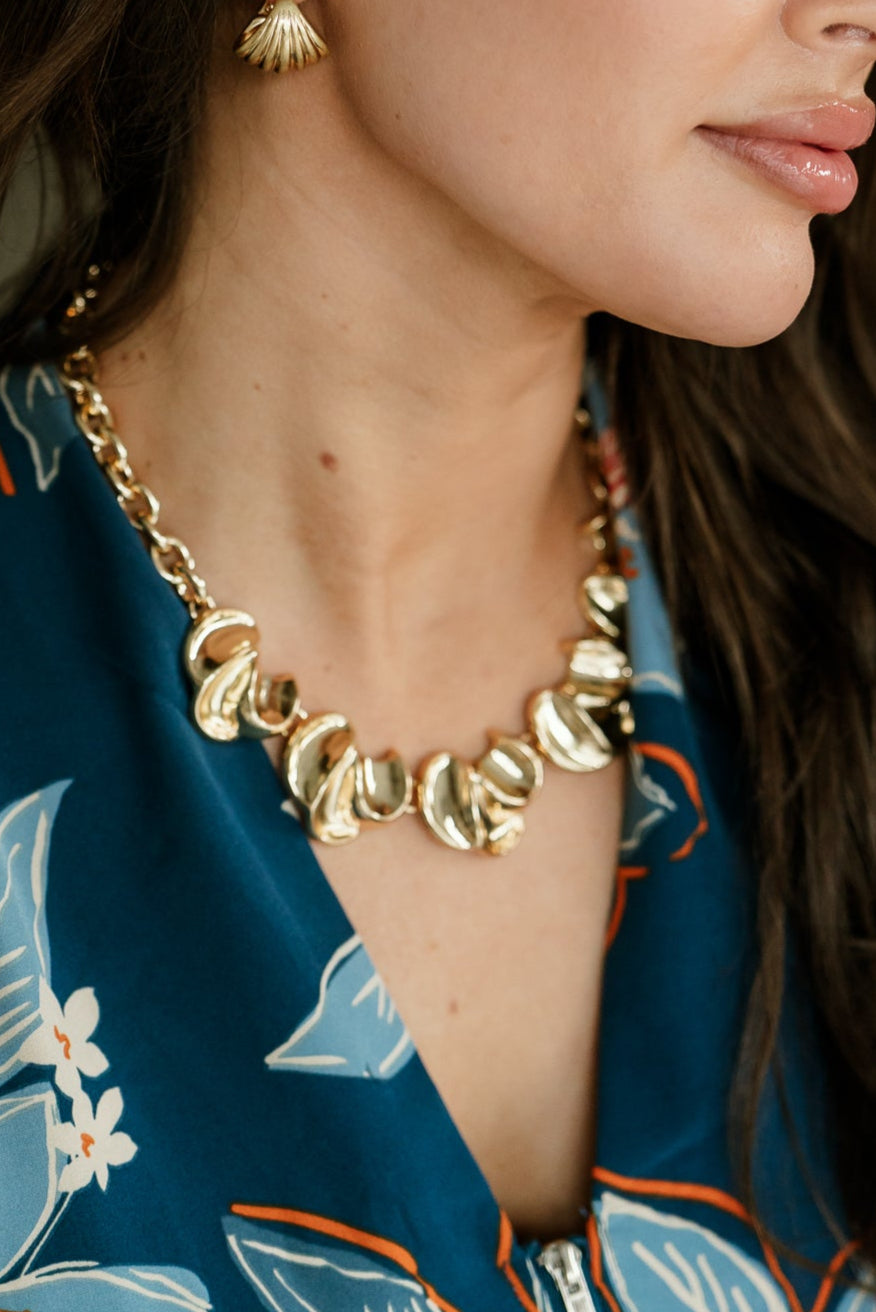 Sona Gold Petal Statement Necklace - close front view on model