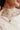 Cleo Gold Cross Pendant Necklace - close up view on model