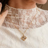 Cleo Gold Cross Pendant Necklace - close up view on model