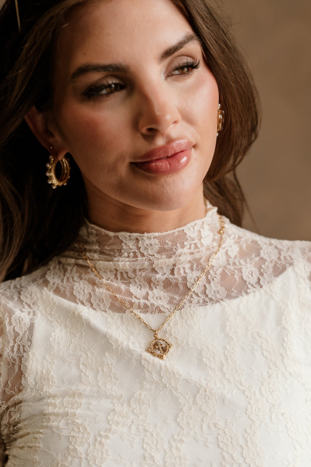 Cleo Gold Cross Pendant Necklace - front view on model