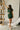 Full body front view of female model wearing the Sutton Green Knit Mini Skirt