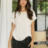 Upper body front view of female model wearing the Sheridan Tee in the color Cream