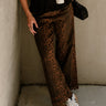 front view of the Asheville Cheetah Eyelet Wide Leg Jeans