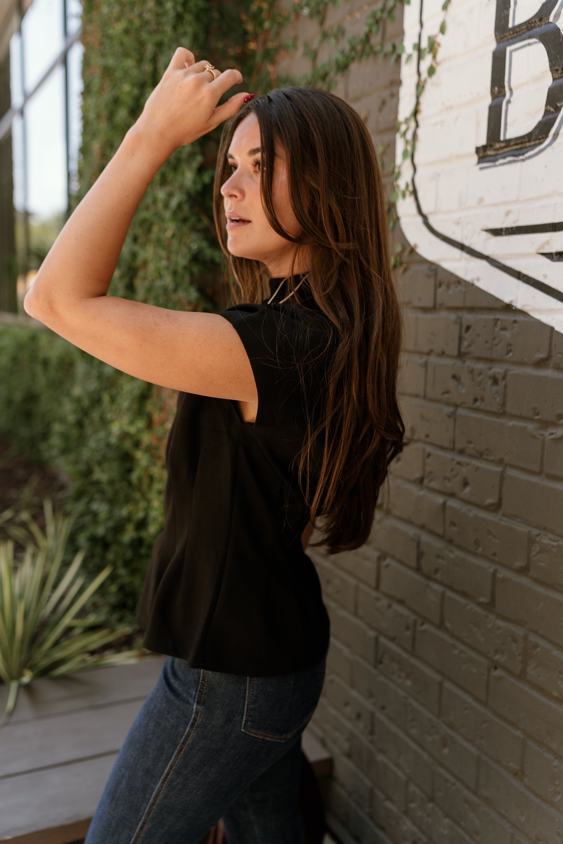 Alora Black Pleated Flare Top- close up side view