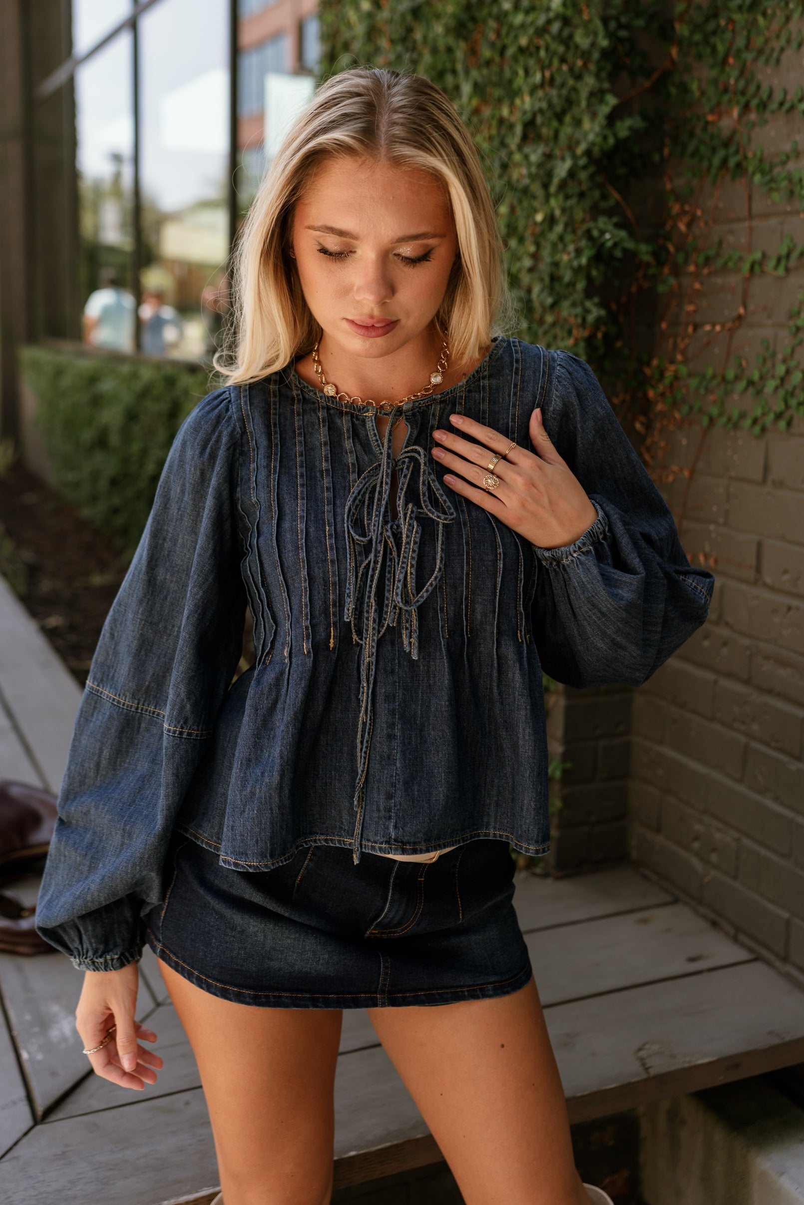 Lena Dark Denim Pleated Flare Long Sleeve Top- close up top view