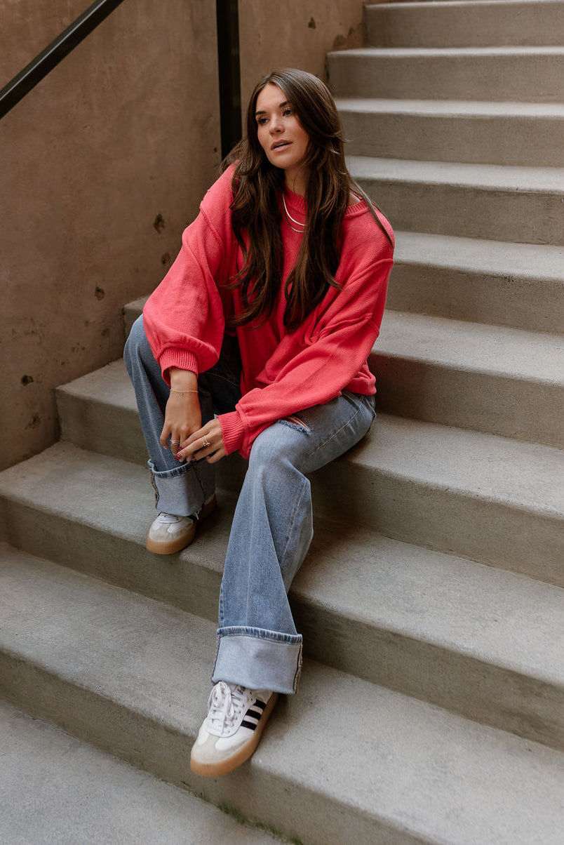 Jeanie Red Coral Balloon Sleeve Sweater - full body sitting view