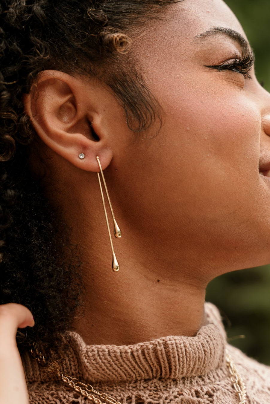Kayla Gold Teardrop Earrings - close side view on model