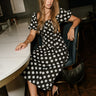 Virginia Black & White Polka Dot Midi Dress - full body sitting view
