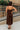 Full body back view of female model wearing the Kristi Brown Maxi Dress