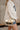Rowan Clear & Gold Purse - front view on model