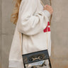 Rowan Clear & Black Purse - side view of model