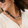 Charlotte Black & Gold Scarf Necklace- close up front view on model