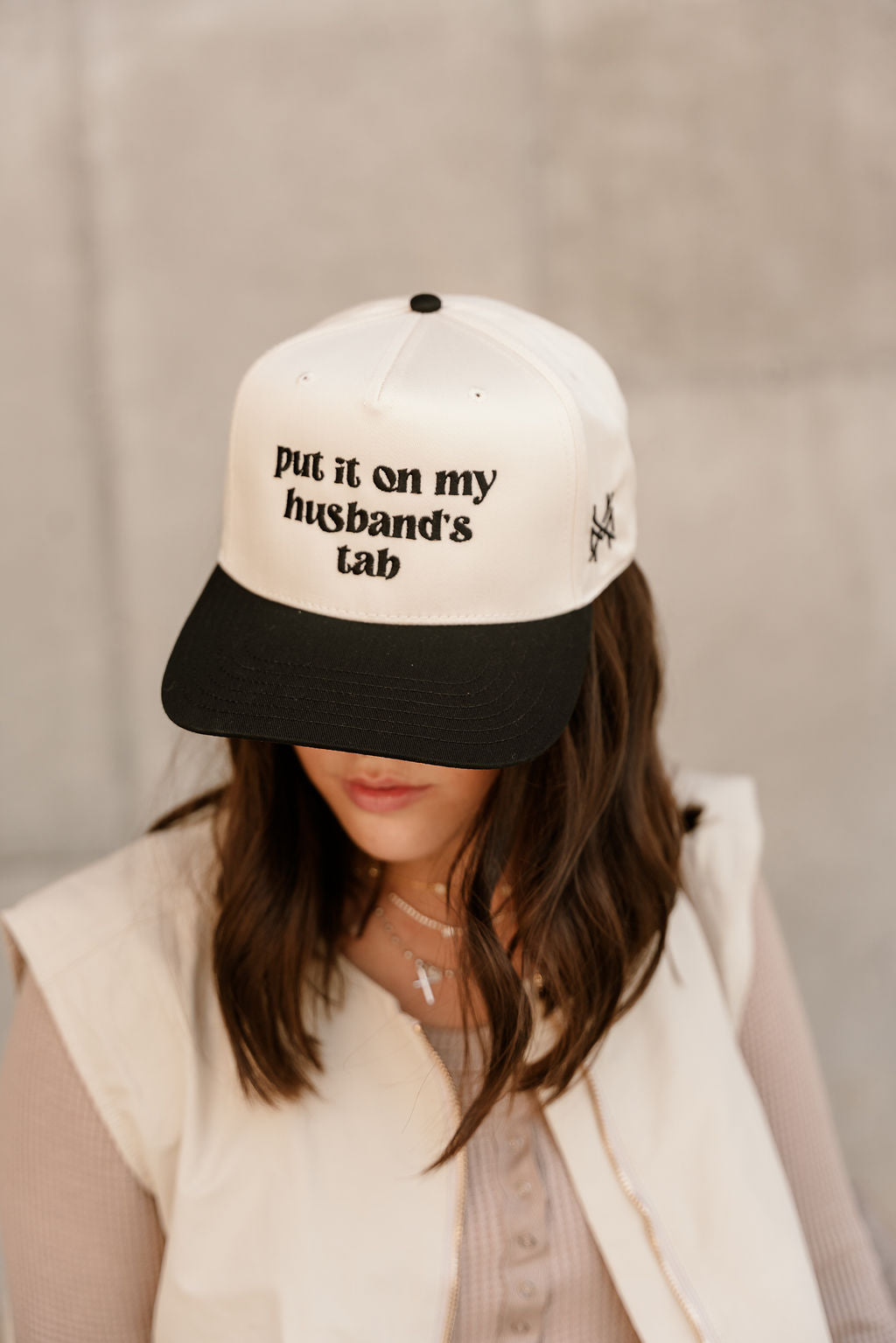 Put It On My Husband's Tab Trucker Hat - front view on model