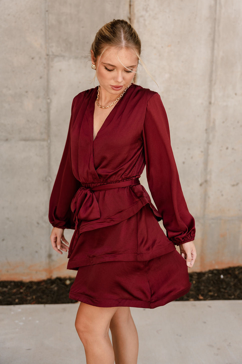 Selah Burgundy Satin Flare Mini Dress- frontal left side view